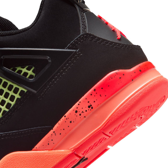 Close-up of kids retro 4 side: black upper with red-orange midsole and speckled accents