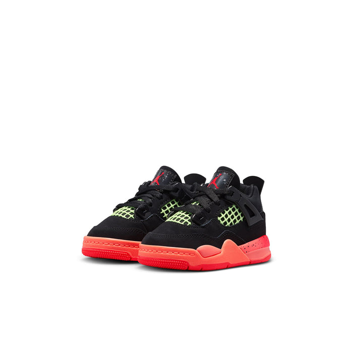 Toddler black sneakers with neon green grid panels and bright red sole, front view