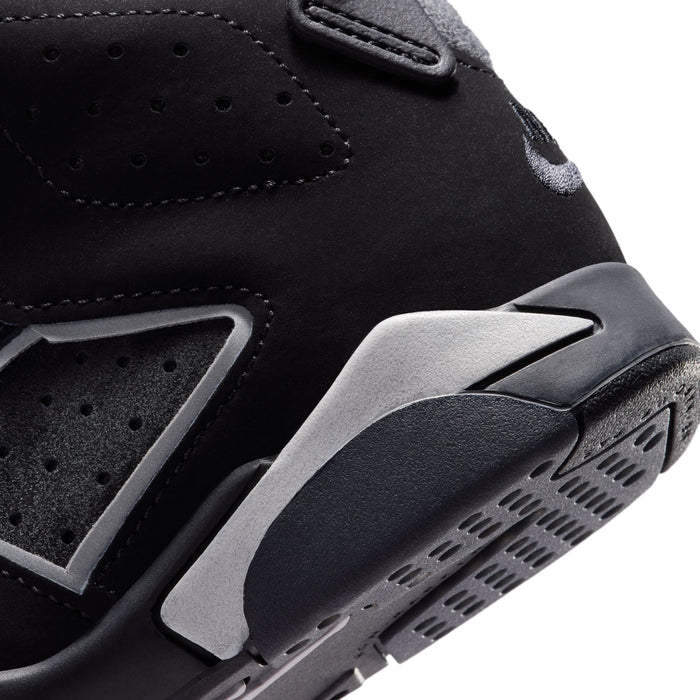 Kids black high-top sneakers close-up of side panels and gray traction outsole