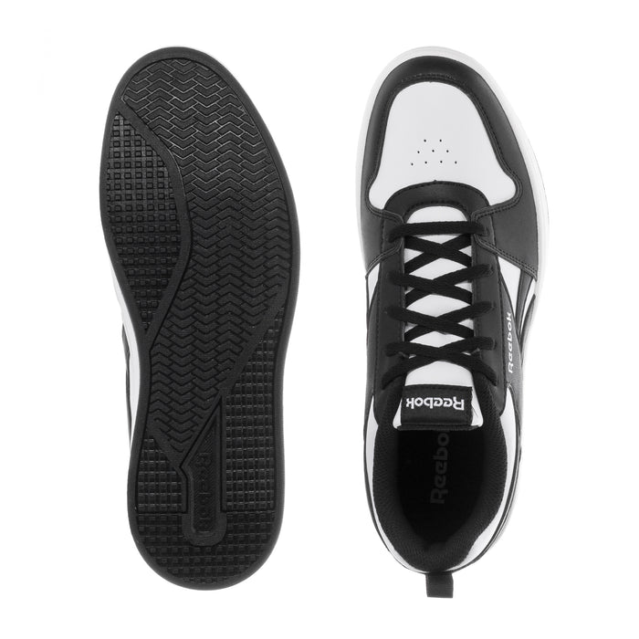 Youth Reebok sneaker outsole and interior view, black tread sole and lace opening