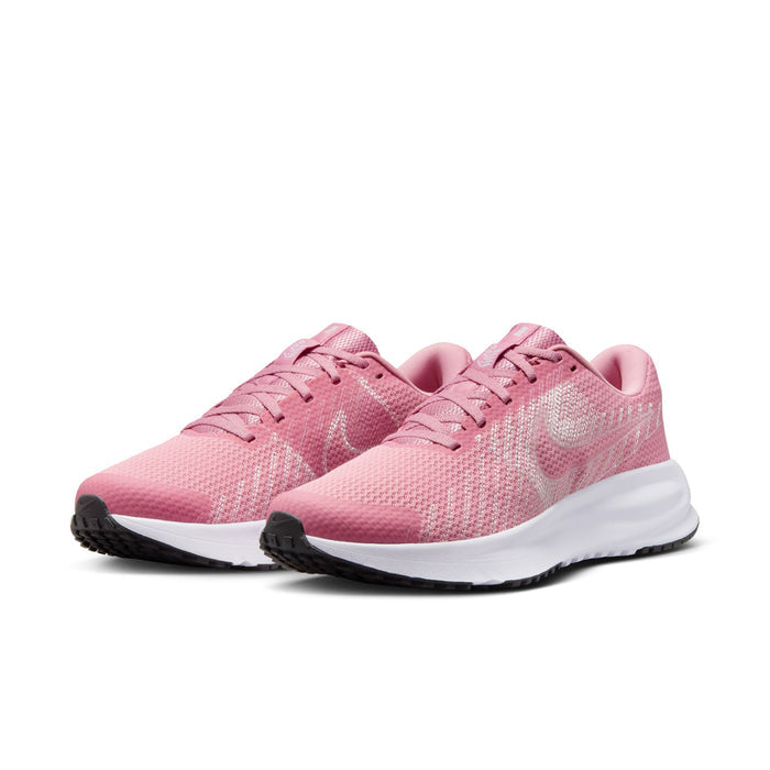Women’s running shoes, pink knit upper with lace-up design, angled side view