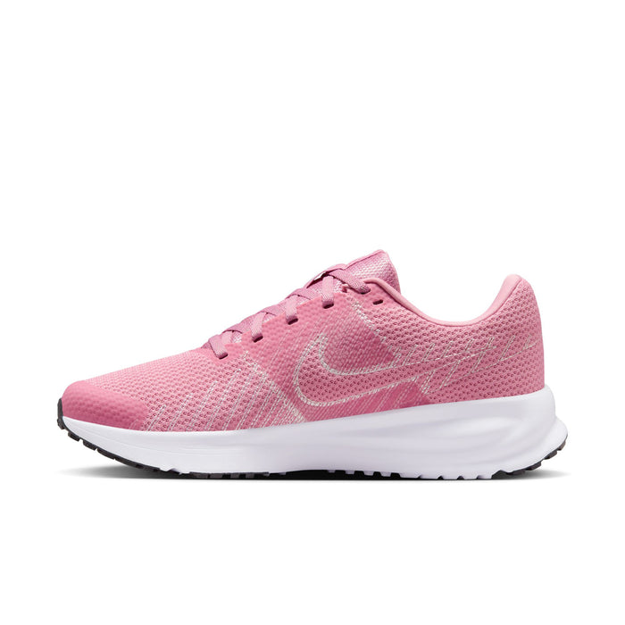 Women’s running shoes in pink with lace-up front, visible swoosh logo on side