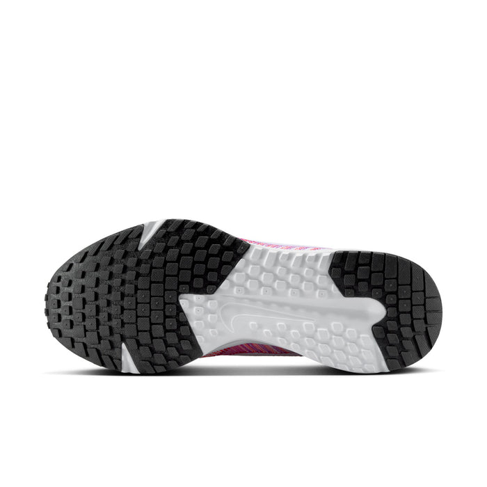 Women’s running shoe outsole view with dark tread and light midsole, flexible cushioning.