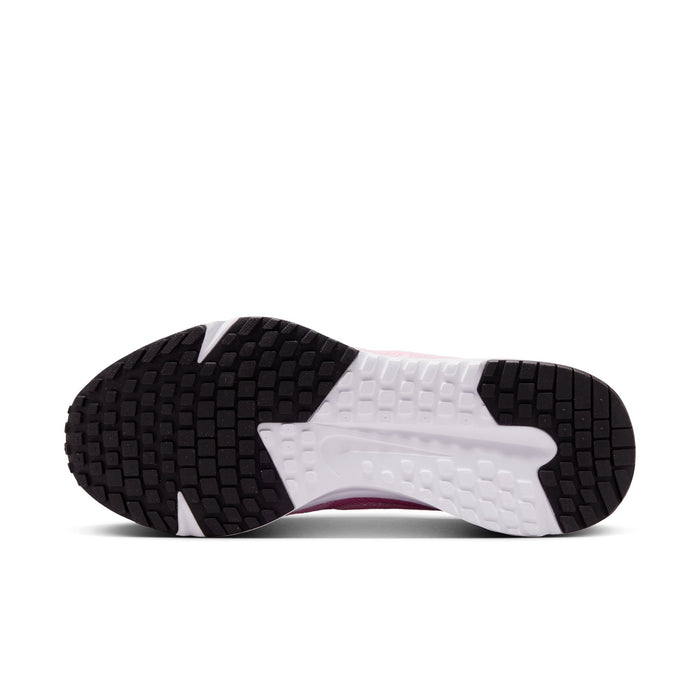 Women’s running shoes outsole view: black tread pods on white rubber base