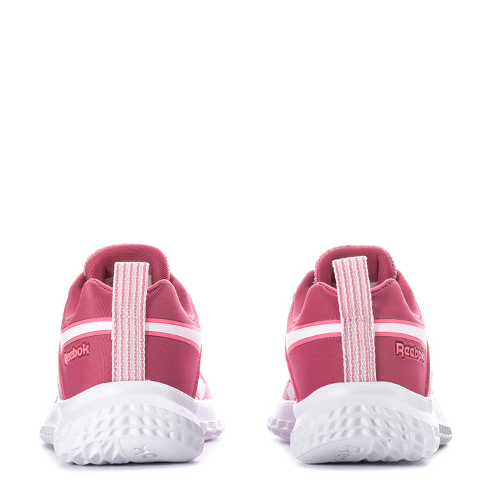 Kids pink sneakers heel view with Reebok branding, white midsoles, pull loop tabs