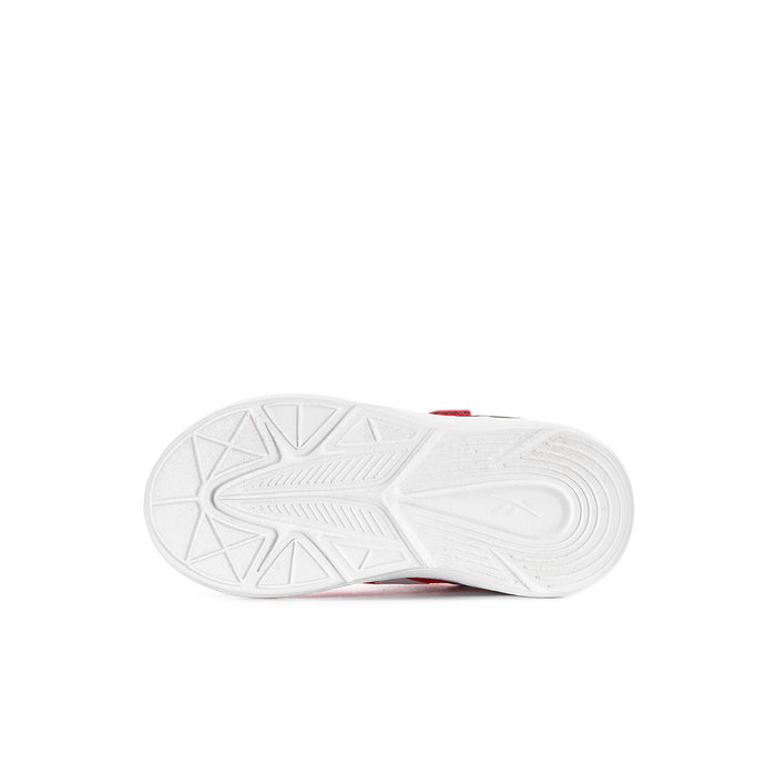 Toddler shoe outsole with white textured tread and red trim edge