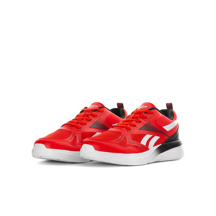 Youth red sneakers with white side stripes, black accents, and white rubber sole