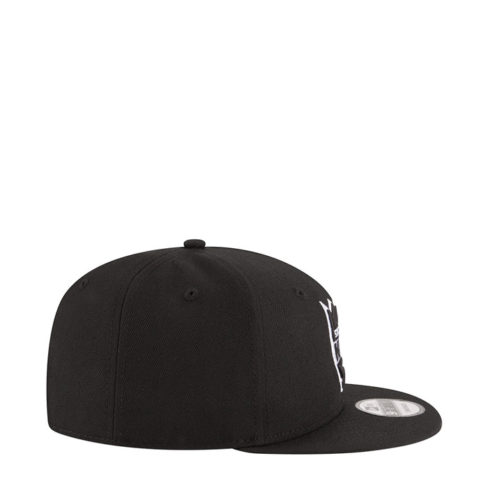 Black baseball cap side view with white Kings logo embroidery