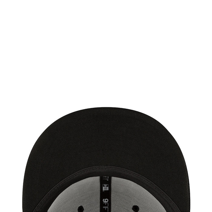 Black cap top view with embossed fabric texture and center seam