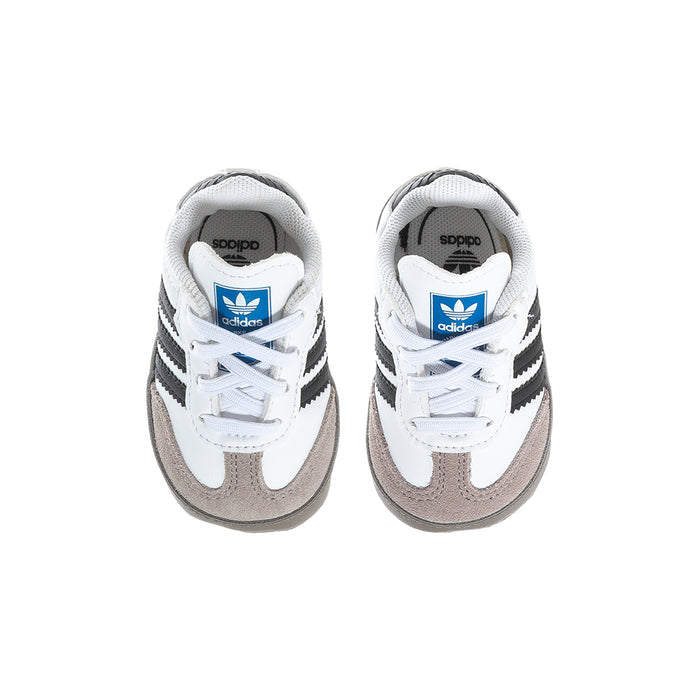 Infant adidas Samba sneakers with white laces, black stripes, and gray toe panels