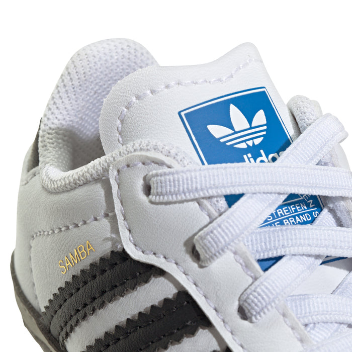 Infant adidas Samba sneakers: close-up of tongue logo and lace-up front