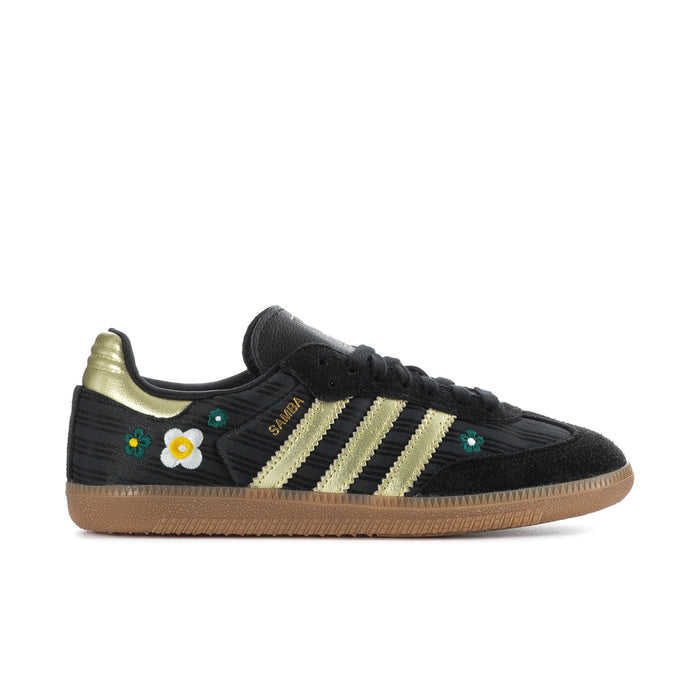 Women’s black Samba sneakers with gold stripes, daisy and floral accents, gum sole