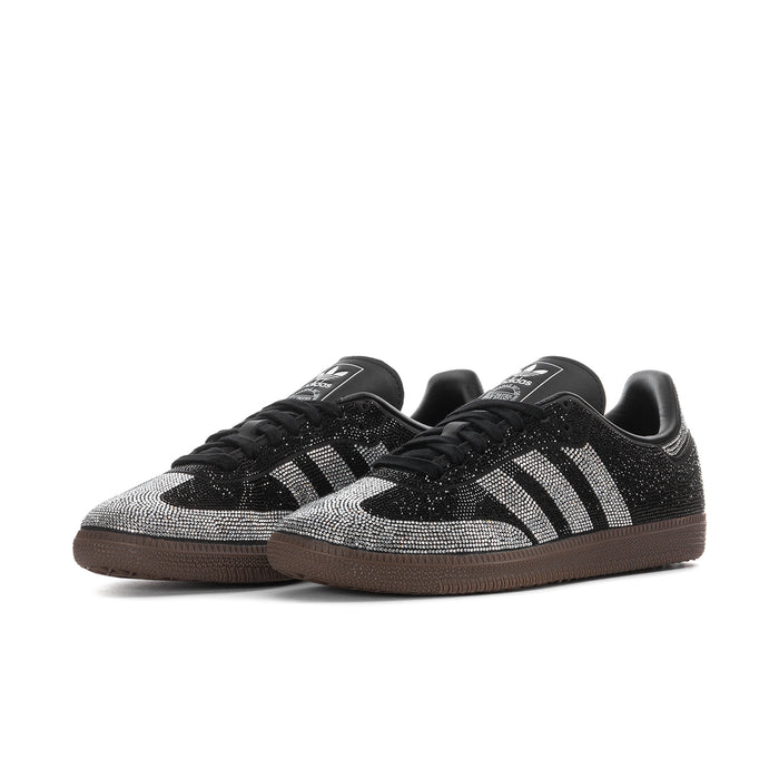 Pair of black and white rhinestone adidas Samba OG women’s sneakers with gum soles