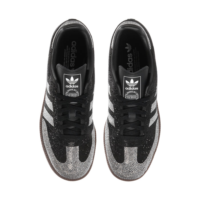 Close-up of black and silver rhinestone adidas Samba OG women’s sneakers tongue and heel