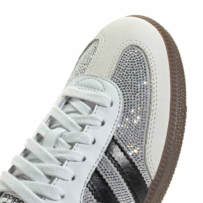 Close-up of rhinestone toe and side panel with white laces and gum trim