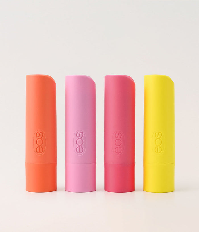 Four EOS lip balm tubes in different colors on a white background