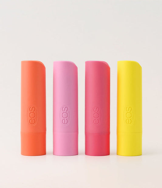Four EOS lip balm tubes in different colors on a white background