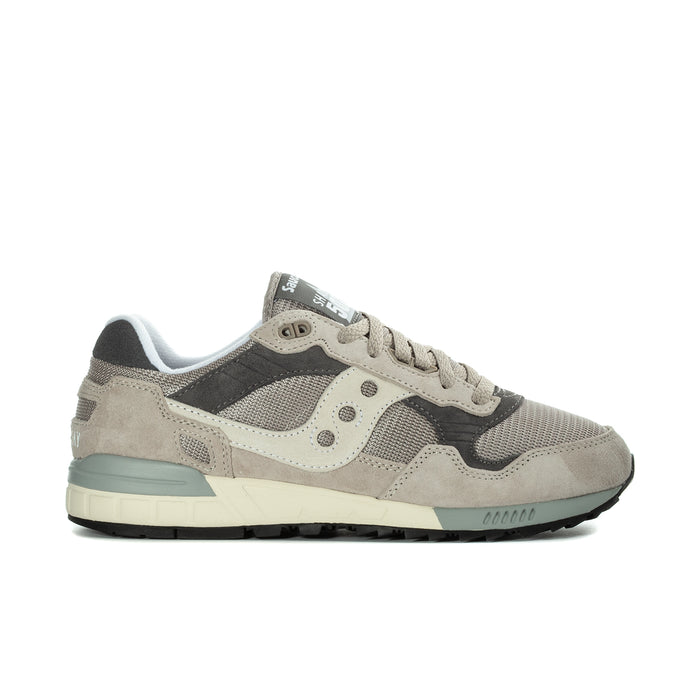 Men's Saucony running sneakers in beige and dark gray, lace-up with teal midsole