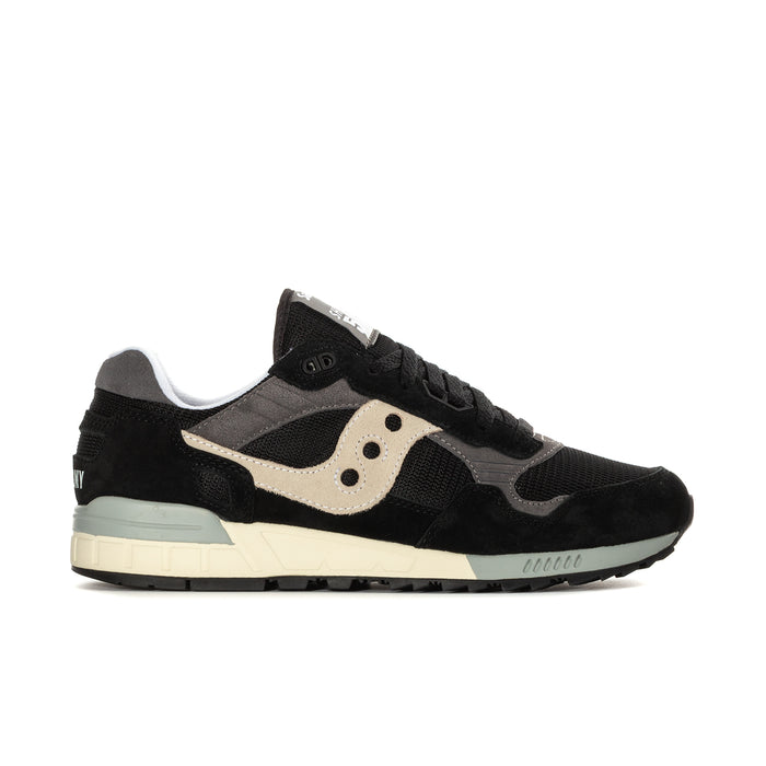 Men's Saucony Shadow 5000 lace-up running shoes, black with cream accents and teal sole.