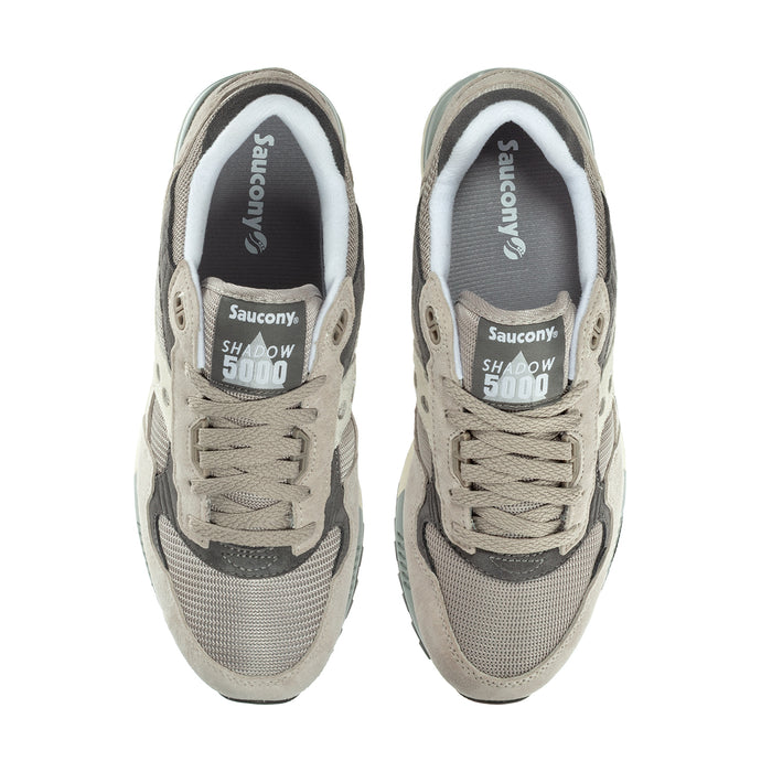 Men's Saucony sneakers, heel branding and laces on beige and dark gray upper
