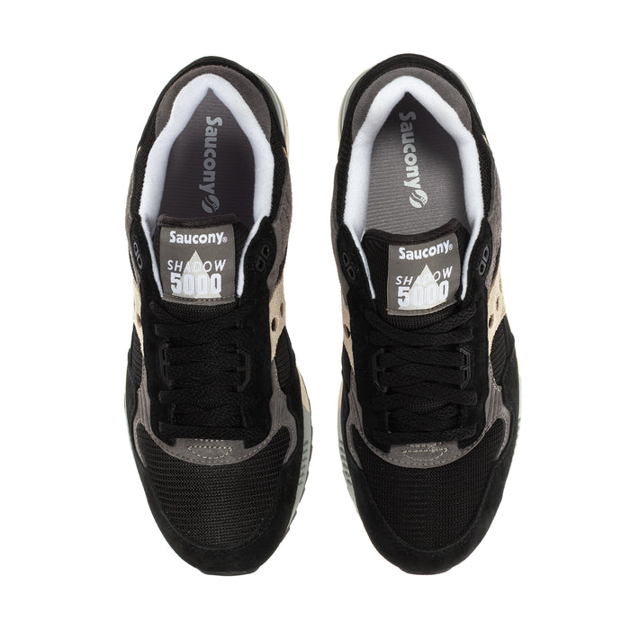 Men's Saucony Shadow 5000 shoes, tongue label and laces, black uppers with gray lining.