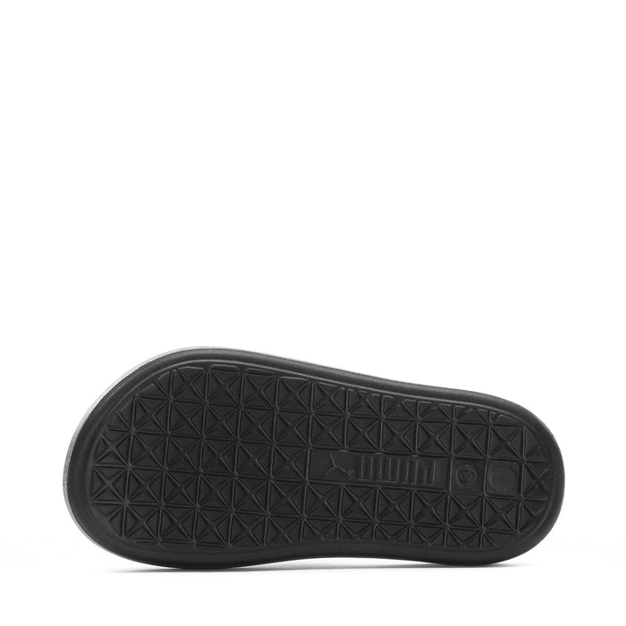 Youth slide sandal outsole tread, black rubber with geometric pattern