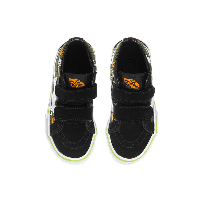 Kids black mid-top sneakers, two Velcro straps, orange Halloween logo at heel.