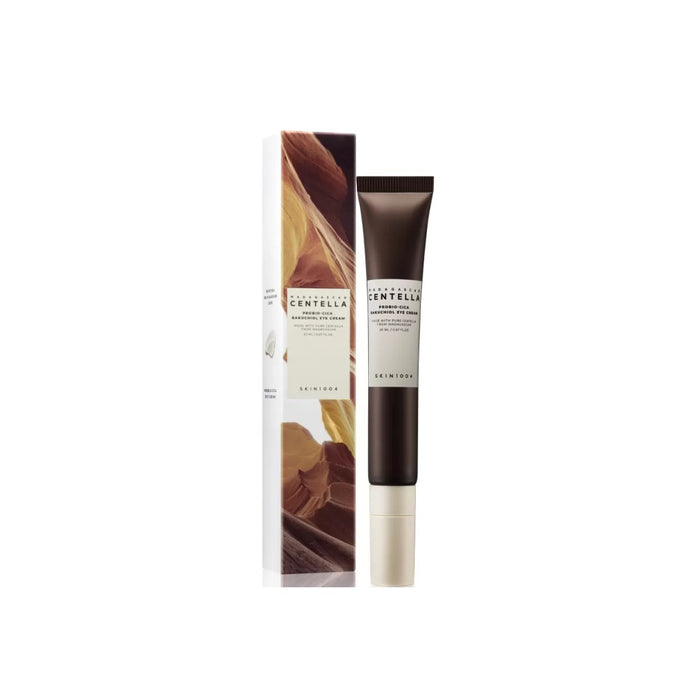 SKIN1004 Madagascar Centella Probio-Cica Bakuchiol Eye Cream combines the soothing power of Centella Asiatica Extract with the skin-renewing benefits of Bakuchiol. Enriched with Niacinamide, Squalane, Shea Butter, and Ceramide NP, this eye cream deeply hydrates and nourishes the delicate eye area while strengthening the skin barrier and targeting fine lines and wrinkles. The addition of Lactobacillus/Centella Asiatica Ferment Filtrate enhances skin's resilience, making it a perfect choice for th