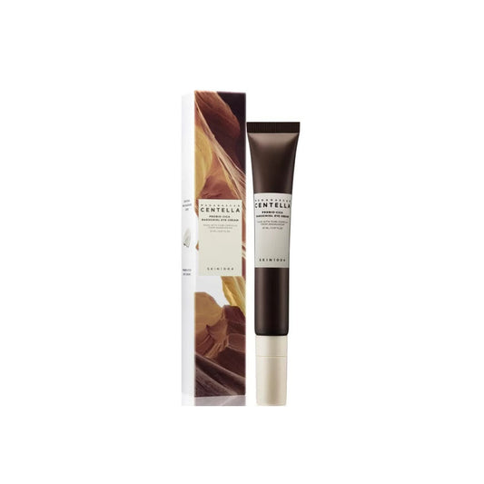 SKIN1004 Madagascar Centella Probio-Cica Bakuchiol Eye Cream combines the soothing power of Centella Asiatica Extract with the skin-renewing benefits of Bakuchiol. Enriched with Niacinamide, Squalane, Shea Butter, and Ceramide NP, this eye cream deeply hydrates and nourishes the delicate eye area while strengthening the skin barrier and targeting fine lines and wrinkles. The addition of Lactobacillus/Centella Asiatica Ferment Filtrate enhances skin's resilience, making it a perfect choice for th
