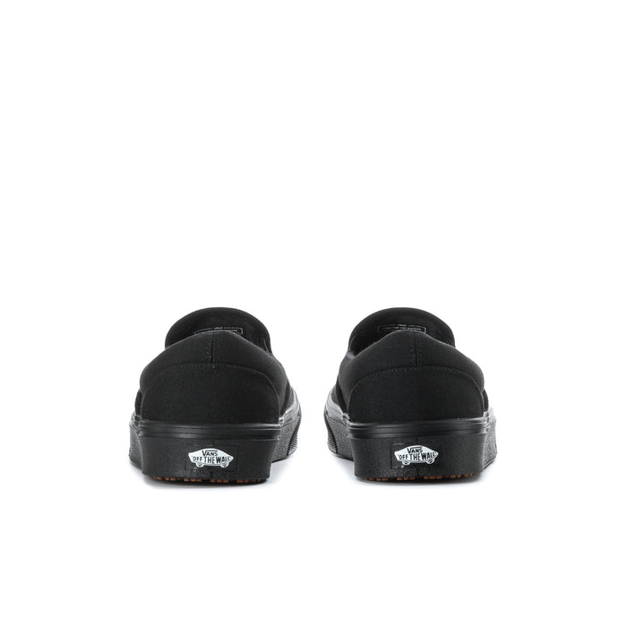 Black slip-on sneakers with rear heel tab and patterned outsole
