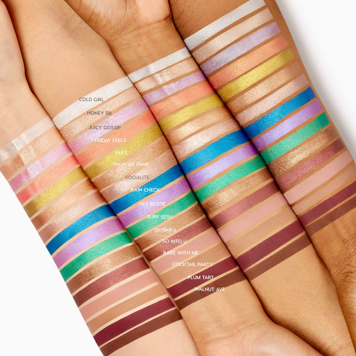 ColourPop Shadow Stix So Into U swatched as a slim stripe on four skin tones, a muted rosy‑mauve shade shown among rows of labeled colors, highlighting the creamy eyeshadow stick’s pigment and blend across light to deep arms.