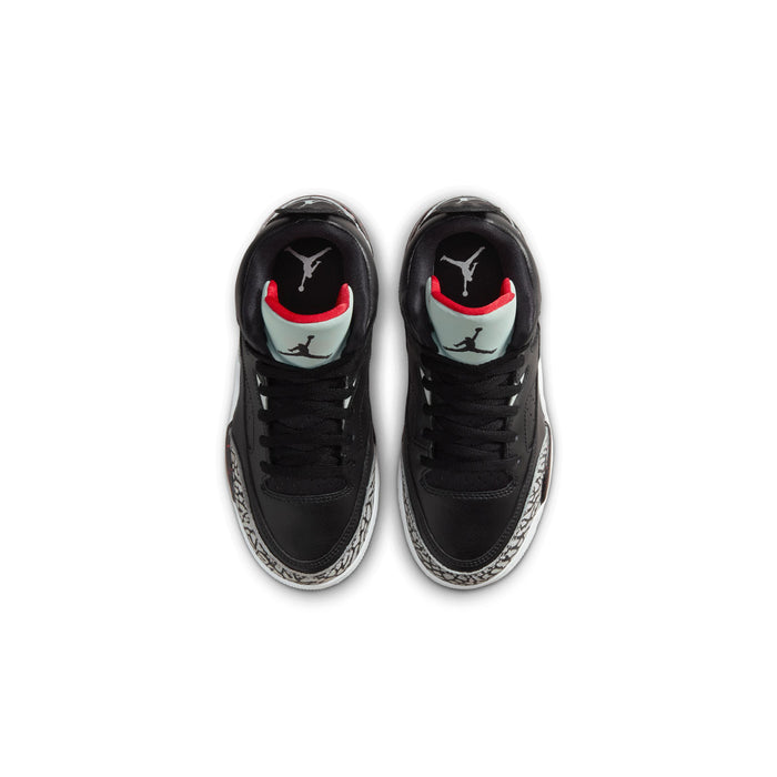 Kids black sneakers with red and white heel accents and visible Air Jordan logo