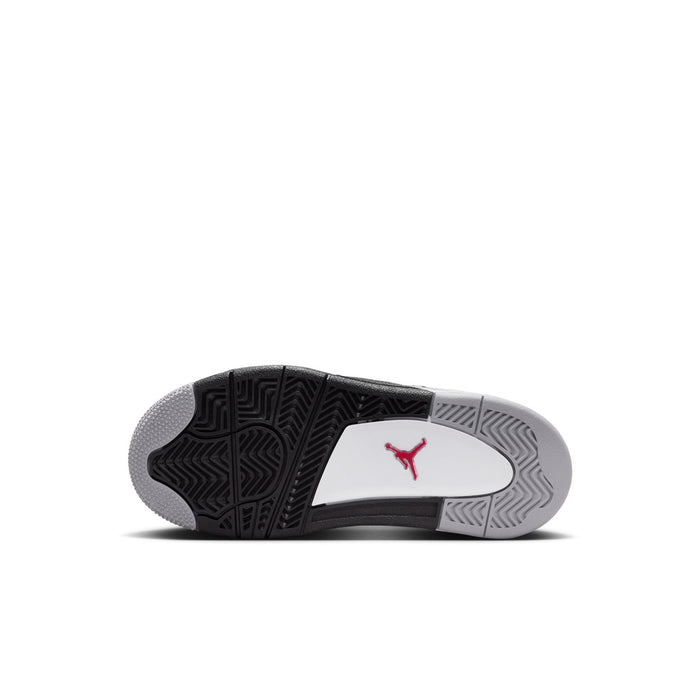 Kids shoe outsole, black tread with grey pattern and red Jumpman logo.