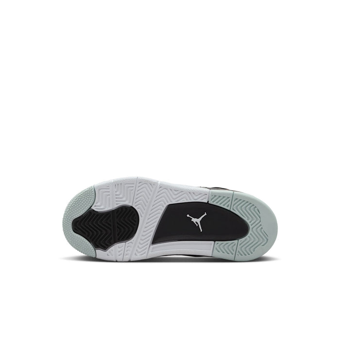 Kids sneaker outsole with patterned tread in white, black, and light gray