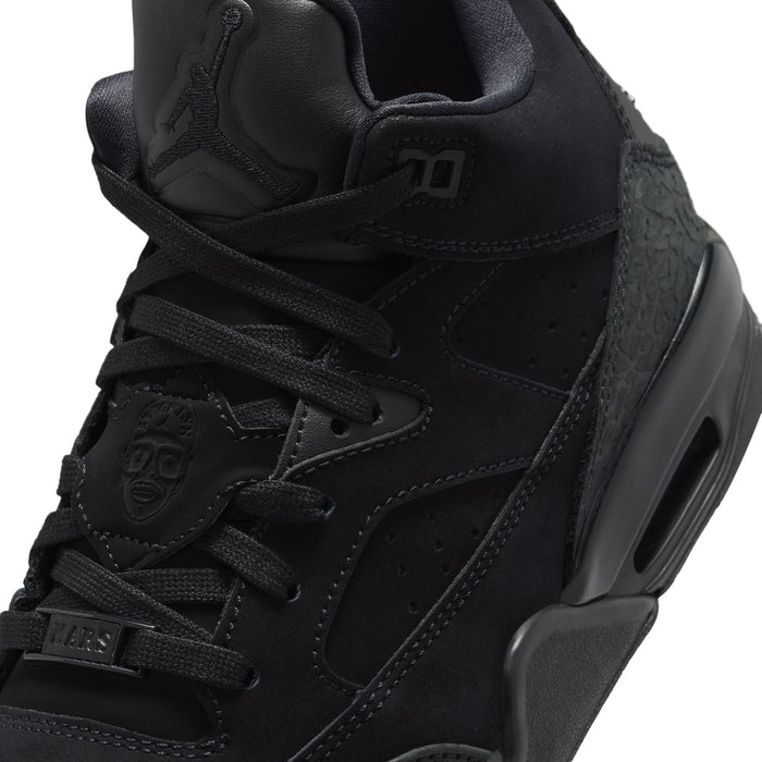 Black youth basketball shoes, close-up of laces, stitching, and logo accents