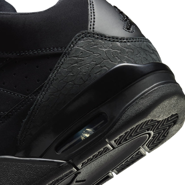 Black youth basketball shoes, close-up of side panel texture and branding