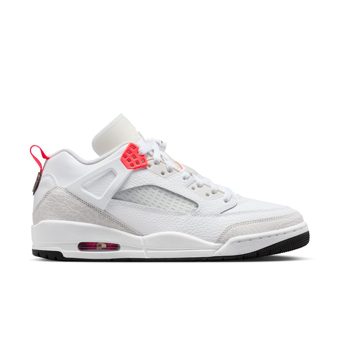 White low-top sneakers with red accents, mesh panels, and air-cushion sole detail