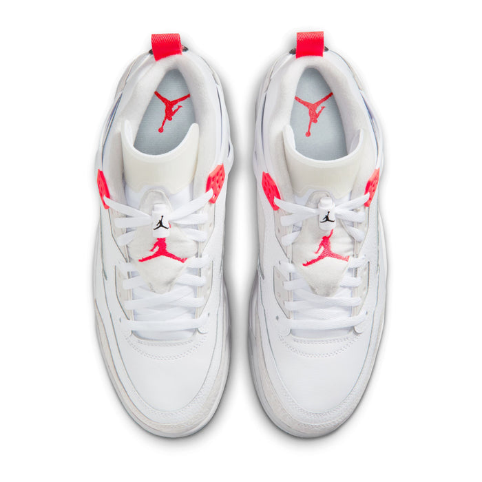 White sneakers with red Jumpman logo on tongues and uppers, lace-up front view