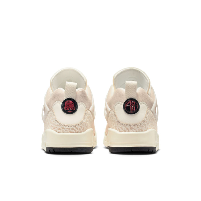 Cream low-top sneakers with rear heel tabs and red circular logo on the back