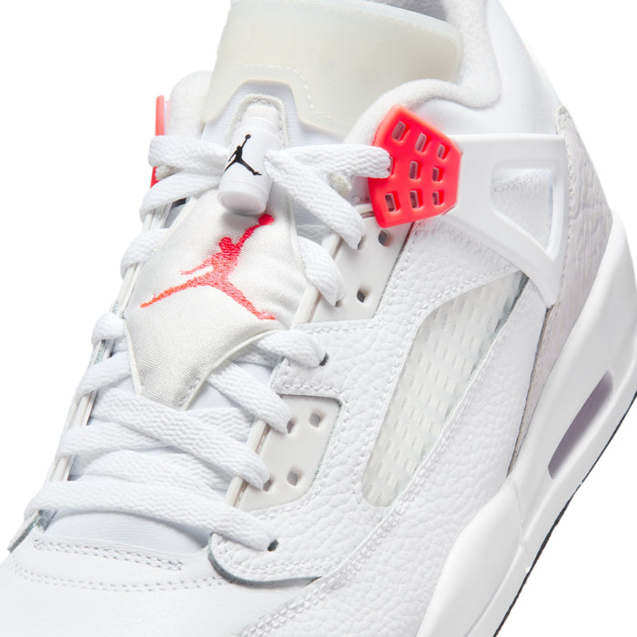 Close-up of white sneaker upper with red lace wings and mesh side panel
