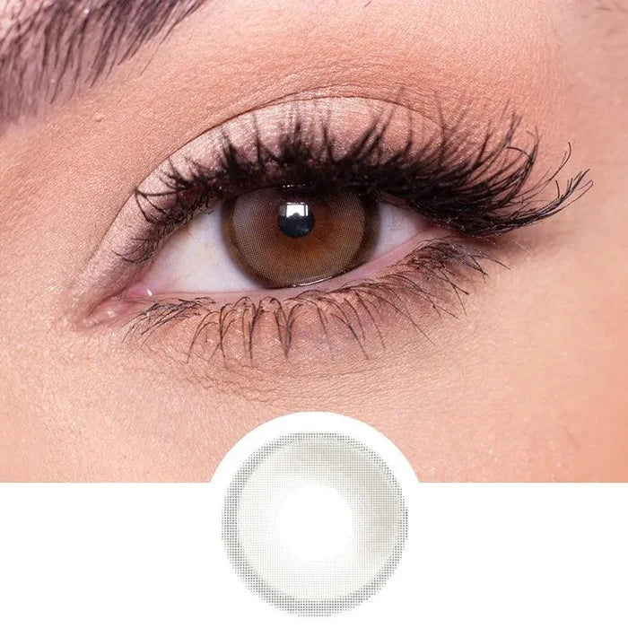 EyeCandys Amelie Grey prescription colored contact lenses on dark eyes  next to a cutout of the lens design
