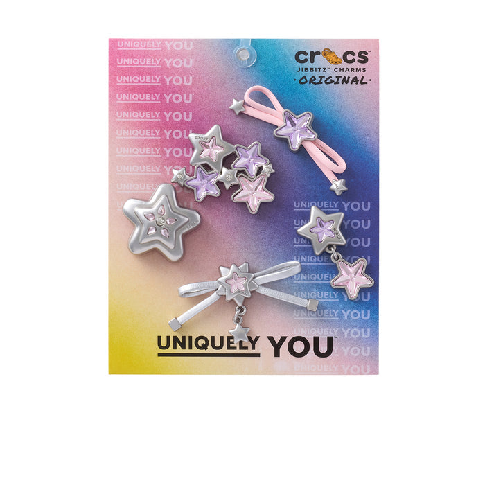 Jibbitz charm pack with silver and pink star pins and bow accents on card