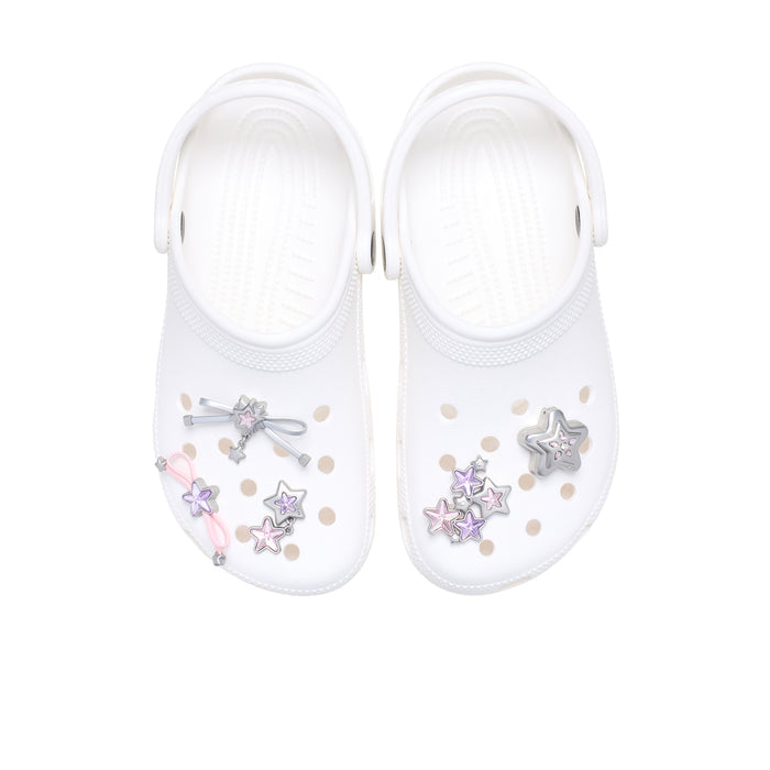 White clogs with star and bow Jibbitz charms in silver and pink