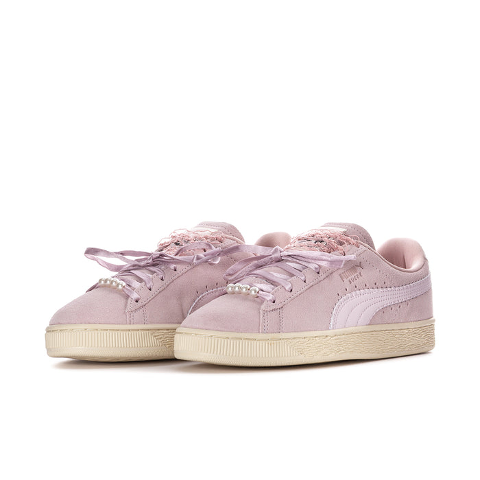Women’s pink suede lace-up sneakers with cream midsole and ribbon-style bow detail