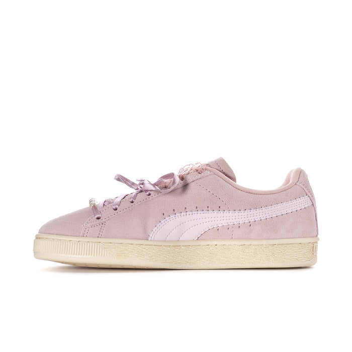 Women’s pink suede lace-up sneakers with white stripe detail and cream platform sole