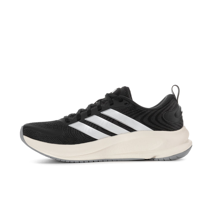 Women's black mesh running shoe with white stripes and cream foam midsole