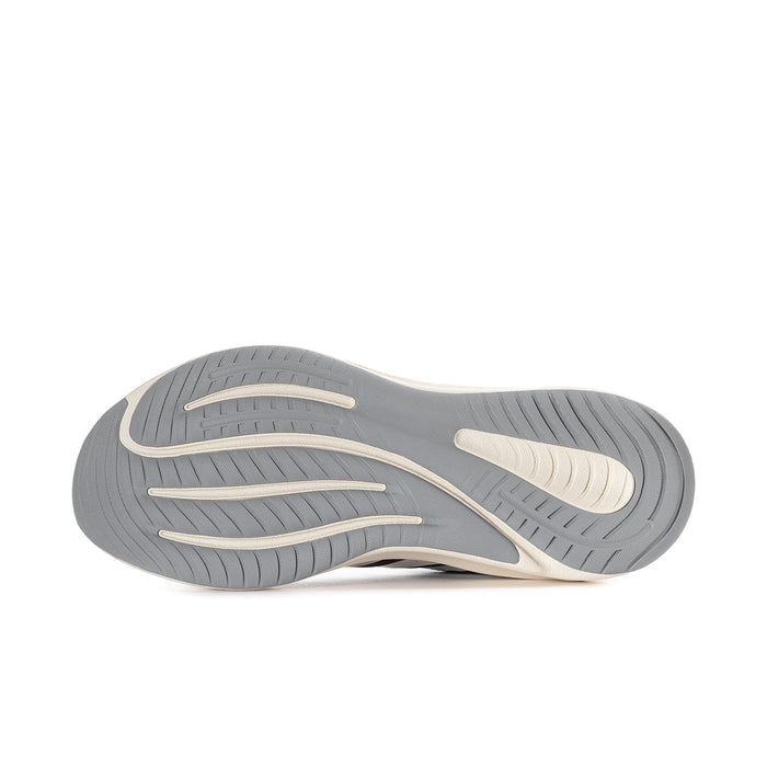 Women's running shoe outsole with deep gray tread and light trim