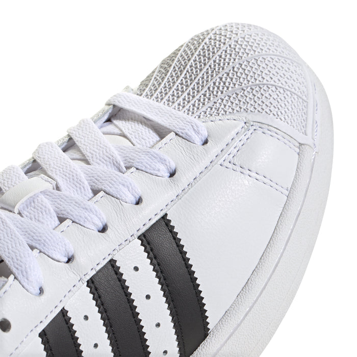 Close-up of men's adidas Superstar II sneaker upper with white laces and black stripes