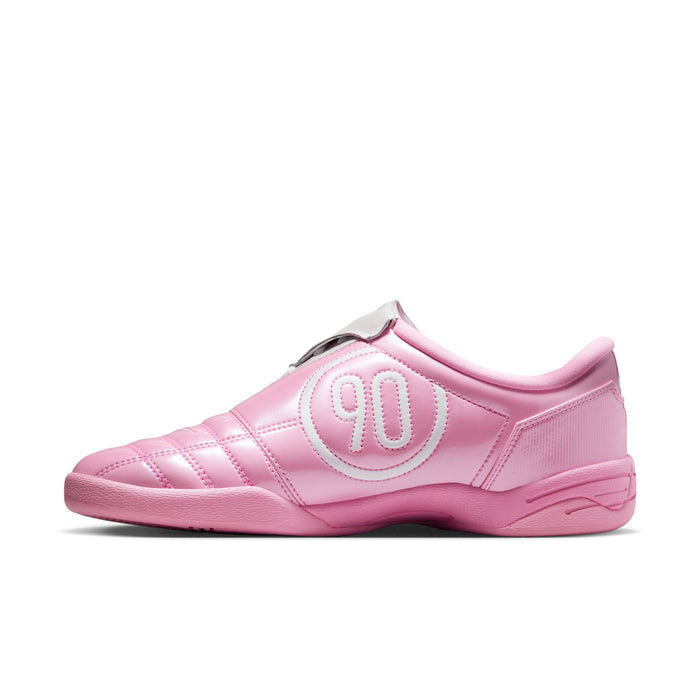 Pink and white women's low-top sneakers, side view with textured stripes