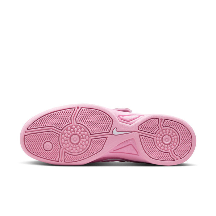 Pink outsole of women's low-top sneakers with textured traction pattern